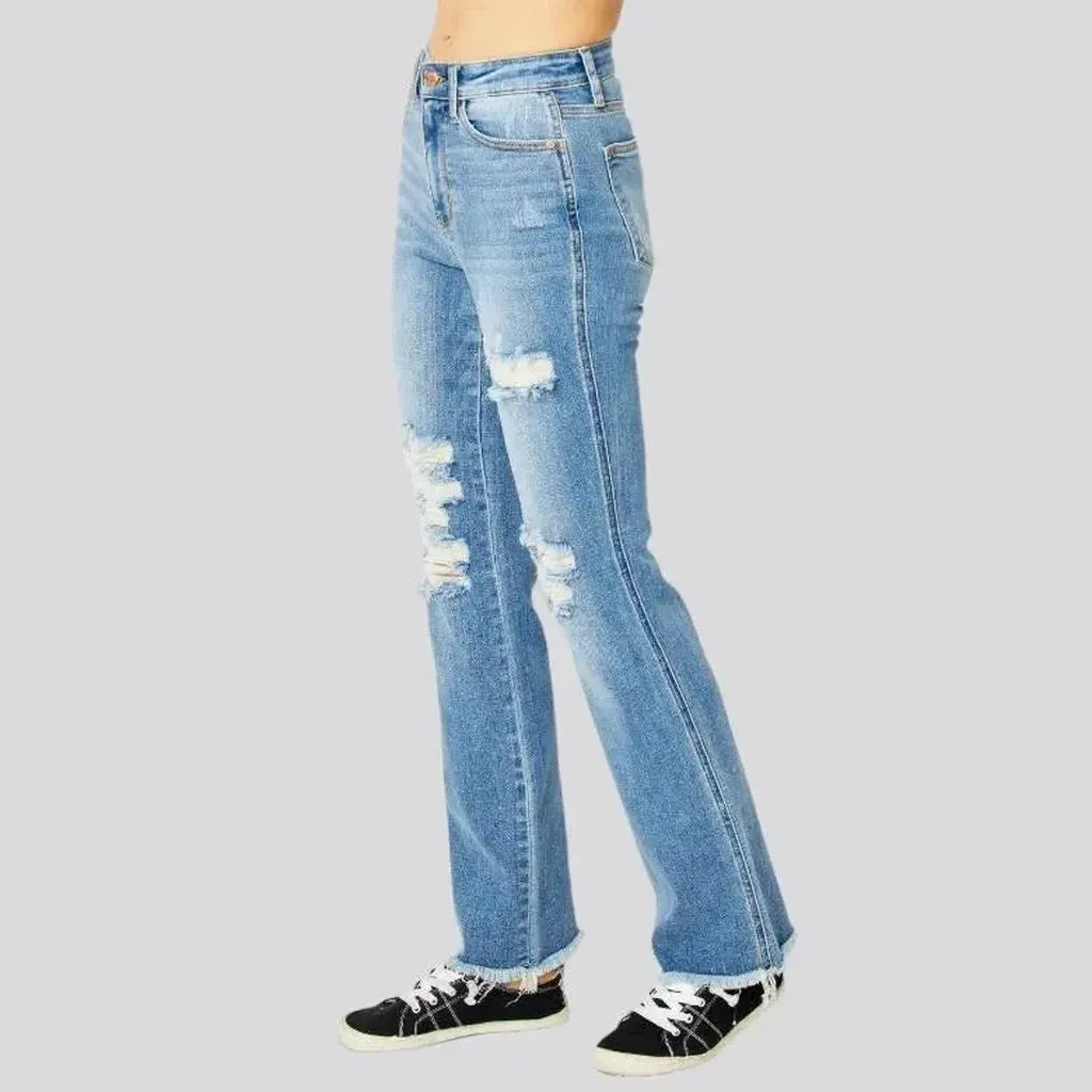 Whiskered women's distressed jeans